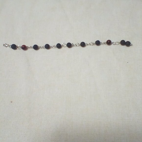 Black lava bracelet with 2 tiger eye beads - Picture 1 of 1
